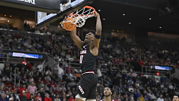 Mar 20, 2025; Providence, RI, USA;  Omaha Mavericks forward Marquel Sutton (10) scores against St. John's Red Storm during the first half at Amica Mutual Pavilion. Mandatory Credit: Eric Canha-Imagn Images