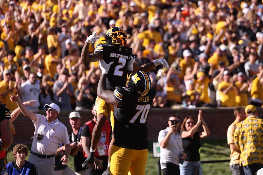 Missouri wide receiver Caleb Goodie (2) celebrates a touchdown with offensive lineman Cayden Green.