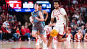 Dec 1, 2024; Lincoln, Nebraska, USA; Nebraska Cornhuskers guard Brice Williams (3) drives against North Florida Ospreys guard Oscar Berry (33) during the first half at Pinnacle Bank Arena.