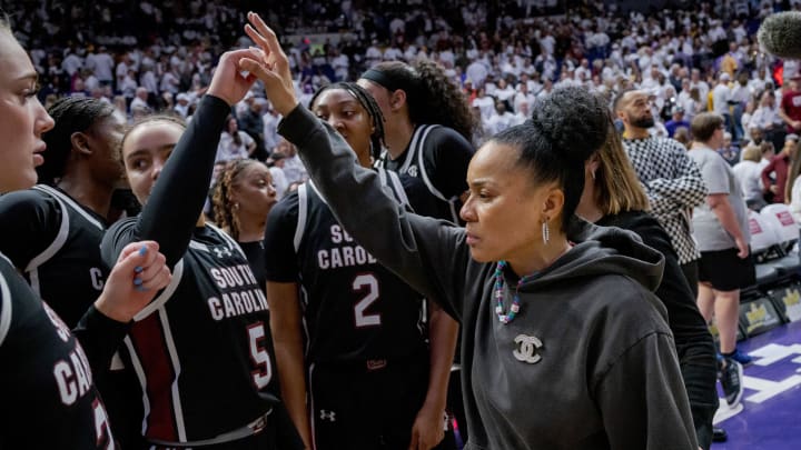 South Carolina basketball coach Dawn Staley with her team during their undefeated, national championship-winning 2023-2024 season