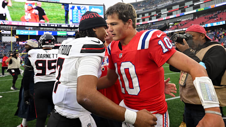 Oct 13, 2024; Foxborough, Massachusetts, USA; Houston Texans quarterback C.J. Stroud (7) hugs New England Patriots quarterback Drake Maye (10) after a game at Gillette Stadium. Mandatory Credit: Brian Fluharty-Imagn Images