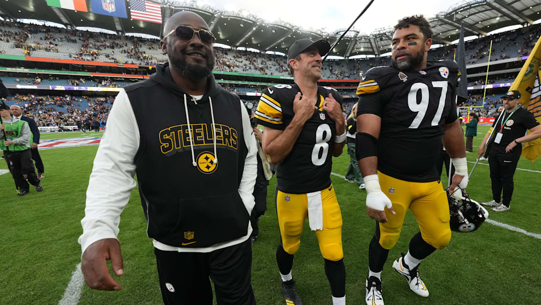 Sep 28, 2025; Dublin, Ireland; Pittsburgh Steelers coach Mike Tomlin (left), quarterback Aaron Rodgers (center) and defensive tackle Cameron Heyward (97) leave the field after an NFL International Series game against the Minnesota Vikings at Croke Park. Mandatory Credit: Kirby Lee-Imagn Images