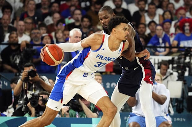 France power forward Victor Wembanyama (32) controls the ball against United States guard Kevin Durant (7) in the second half