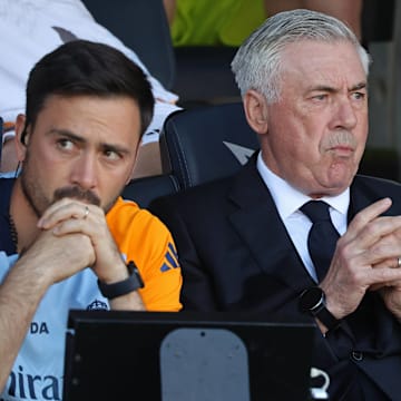Davide Ancelotti (left) and Carlo Ancelotti look on from the sidelines from last weekend's El Clasico.