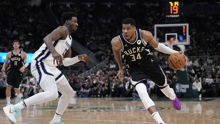 Feb 2, 2025; Milwaukee, Wisconsin, USA; Milwaukee Bucks forward Giannis Antetokounmpo (34) drives to the basket against Memphis Grizzlies forward Jaren Jackson Jr. (13) in the first half at Fiserv Forum. Mandatory Credit: Michael McLoone-Imagn Images