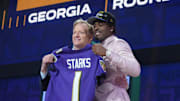 Apr 24, 2025; Green Bay, WI, USA; NFL commissioner Roger Goodell with Georgia Bulldogs safety Malaki Starks after he is selected by the Baltimore Ravens as the number 27 pick in the first round of the 2025 NFL Draft at Lambeau Field. Mandatory Credit: Kirby Lee-Imagn Images