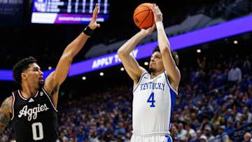 Jan 14, 2025; Lexington, Kentucky, USA; Kentucky Wildcats guard Koby Brea (4) shoots the ball against Texas A&M Aggies guard Jace Carter (0) during the second half at Rupp Arena at Central Bank Center. Mandatory Credit: Jordan Prather-Imagn Images