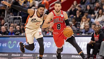 Nov 18, 2024; Detroit, Michigan, USA; Detroit Pistons forward Tobias Harris (12) defends against Chicago Bulls guard Zach LaVine (8)