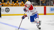 Apr 6, 2025; Nashville, Tennessee, USA;  Montreal Canadiens defenseman Lane Hutson (48) crosses the blue line against the Nashville Predators during the first period at Bridgestone Arena. Mandatory Credit: Steve Roberts-Imagn Images
