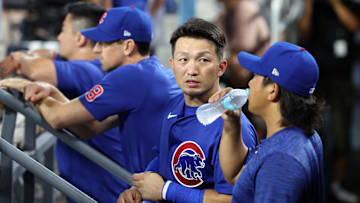 Sep 10, 2024; Los Angeles, California, USA;  Chicago Cubs designated hitter Seiya Suzuki (27, center) talks with starting pitcher Shota Imanaga (18, right) during the ninth inning against the Los Angeles Dodgers at Dodger Stadium. 
