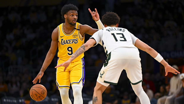 Los Angeles, California, USA; Los Angeles Lakers guard Bronny James (9) looks to pass against Milwaukee Bucks guard Ryan Roll