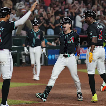 Aug 28, 2024; Phoenix, Arizona, USA; Arizona Diamondbacks outfielder Corbin Carroll (7) celebrates after hitting a grand slam home run against the New York Mets during the eighth inning at Chase Field. Mandatory Credit: Joe Camporeale-Imagn Images