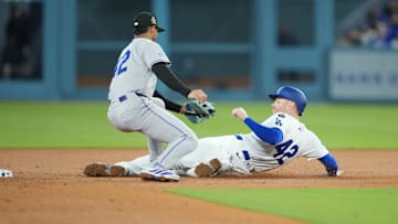 Apr 15, 2025; Los Angeles, California, USA;  Los Angeles Dodgers first baseman Freddie Freeman (5) is tagged out stealing by Colorado Rockies shortstop Ezequiel Tovar (14) in the bottom of the fourth inning at Dodger Stadium. Mandatory Credit: Kirby Lee-Imagn Images
