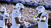 Sep 20, 2025; Fort Worth, Texas, USA; TCU Horned Frogs wide receiver Eric McAlister (1) and wide receiver Jordan Dwyer (7) celebrate after McAlister scores a touchdown against the SMU Mustangs during the first half at Amon G. Carter Stadium. Mandatory Credit: Jerome Miron-Imagn Images
