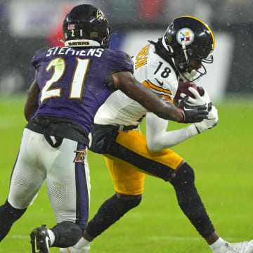 Jan 6, 2024; Baltimore, Maryland, USA; Pittsburgh Steelers  wide receiver Deontae Johnson (18) makes a first quarter catch defended by Baltimore Ravens defensive back Brandon Stephens (21) at M&T Bank Stadium. Mandatory Credit: Mitch Stringer-USA TODAY Sports