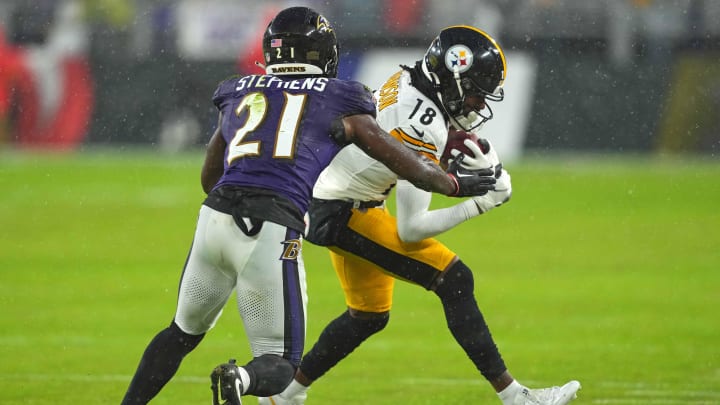 Jan 6, 2024; Baltimore, Maryland, USA; Pittsburgh Steelers  wide receiver Deontae Johnson (18) makes a first quarter catch defended by Baltimore Ravens defensive back Brandon Stephens (21) at M&T Bank Stadium. Mandatory Credit: Mitch Stringer-USA TODAY Sports