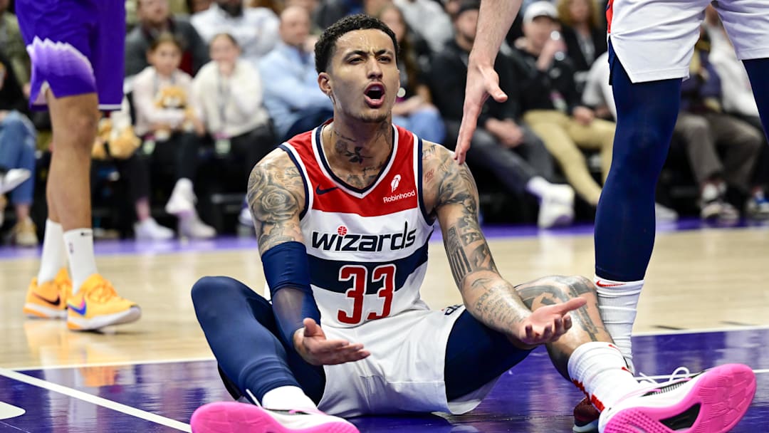 Washington Wizards forward Kyle Kuzma reacts on the ground to a call against the Utah Jazz during the second half at the Delta Center on March 4, 2024.