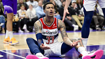 Washington Wizards forward Kyle Kuzma reacts on the ground to a call against the Utah Jazz during the second half at the Delta Center on March 4, 2024.