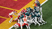 Feb 9, 2025; New Orleans, LA, USA; Philadelphia Eagles quarterback Jalen Hurts (1) rushes the ball for a touchdown against the Kansas City Chiefs during the first quarter in Super Bowl LIX at Caesars Superdome. Mandatory Credit: Kirby Lee-Imagn Images