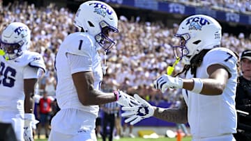 Sep 20, 2025; Fort Worth, Texas, USA; TCU Horned Frogs wide receiver Eric McAlister (1) and wide receiver Jordan Dwyer (7) celebrate after McAlister scores a touchdown against the SMU Mustangs during the first half at Amon G. Carter Stadium. Mandatory Credit: Jerome Miron-Imagn Images