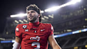 Oct 25, 2025; Cincinnati, Ohio, USA;  Cincinnati Bearcats quarterback Brendan Sorsby walks off the field after defeating the Baylor Bears at Nippert Stadium. Mandatory Credit: Aaron Doster-Imagn Images