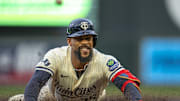 Sep 2, 2025; Minneapolis, Minnesota, USA; Minnesota Twins center fielder Byron Buxton (25) slides into third base for a triple against the Chicago White Sox in the first inning at Target Field. Mandatory Credit: Jesse Johnson-Imagn Images
