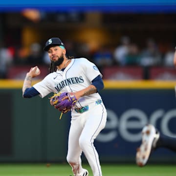 Seattle Mariners shortstop J.P. Crawford (3) throws to first base for a force out on New York Yankees designated hitter Ben Rice (22) (not pictured) during the sixth inning at T-Mobile Park on May 12.