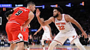 Nov 13, 2024; New York, New York, USA; Chicago Bulls center Nikola Vucevic (9) looks for an opening as New York Knicks center Karl-Anthony Towns (32) defends during the second half at Madison Square Garden. Mandatory Credit: John Jones-Imagn Images