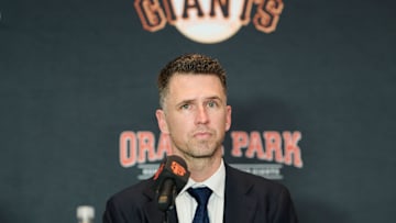 Dec 12, 2024; San Francisco, CA, USA; San Francisco Giants president of baseball operations Buster Posey listens during the introductory press conference for shortstop Willy Adames (not pictured) at Oracle Park.  Mandatory Credit: Robert Edwards-Imagn Images