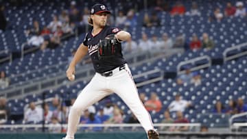Aug 19, 2025; Washington, District of Columbia, USA; Washington Nationals starting pitcher Jake Irvin (27) throws the ball against the New York Mets during the first inning at Nationals Park. 