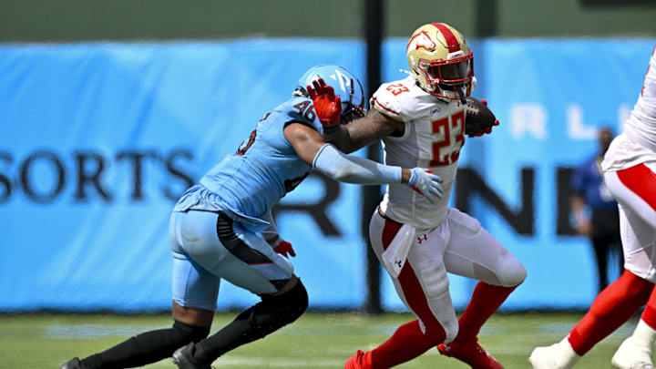 Mar 30, 2024; Arlington, TX, USA; Birmingham Stallions running back Ricky Person (23) stiff arms Arlington Renegades defensive back Myles Dorn (46) during the second half at Choctaw Stadium. Mandatory Credit: Jerome Miron-Imagn Images Mar 30, 2024; Arlington, TX, USA; Birmingham Stallions running back Ricky Person (23) stiff arms Arlington Renegades defensive back Myles Dorn (46) during the second half at Choctaw Stadium. Mandatory Credit: Jerome Miron-Imagn Images