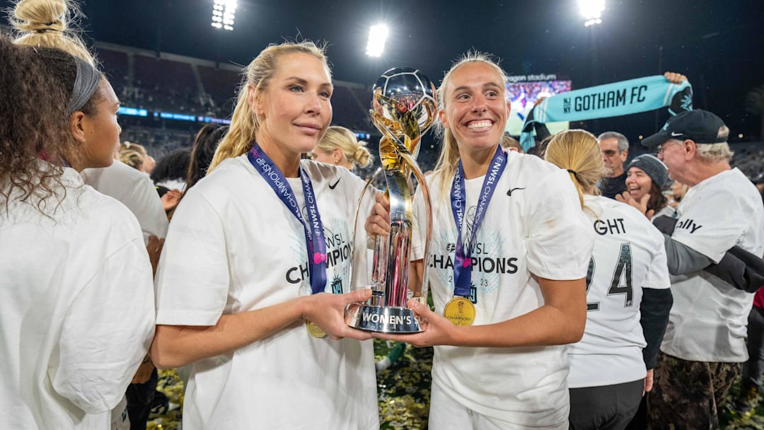 November 11, 2023; San Diego, California, USA; New Jersey/New York Gotham FC midfielder Allie Long (6) and midfielder Maitane Lopez (77) celebrate with the championship trophy after the NWSL Championship match against OL Reign at Snapdragon Stadium. 