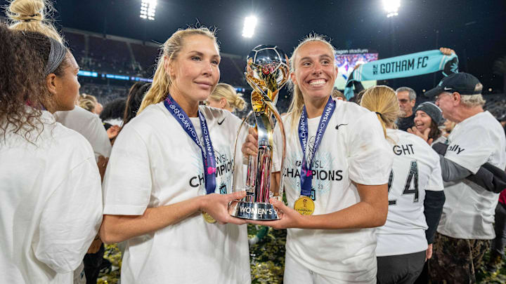 November 11, 2023; San Diego, California, USA; New Jersey/New York Gotham FC midfielder Allie Long (6) and midfielder Maitane Lopez (77) celebrate with the championship trophy after the NWSL Championship match against OL Reign at Snapdragon Stadium. 