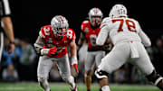 Jan 10, 2025; Arlington, TX, USA; Ohio State Buckeyes defensive end Jack Sawyer (33) and Texas Longhorns offensive lineman Kelvin Banks Jr. (78) in action during the game between the Texas Longhorns and the Ohio State Buckeyes at AT&T Stadium. Mandatory Credit: Jerome Miron-Imagn Images