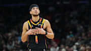 Feb 11, 2025; Phoenix, Arizona, USA; Phoenix Suns guard Devin Booker (1) looks on against the Memphis Grizzlies during the second half at Footprint Center. Mandatory Credit: Joe Camporeale-Imagn Images