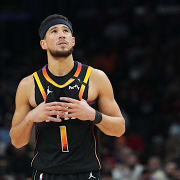 Feb 11, 2025; Phoenix, Arizona, USA; Phoenix Suns guard Devin Booker (1) looks on against the Memphis Grizzlies during the second half at Footprint Center. Mandatory Credit: Joe Camporeale-Imagn Images