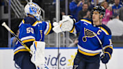 Nov 3, 2025; St. Louis, Missouri, USA; St. Louis Blues center Brayden Schenn (10) celebrates with goaltender Jordan Binnington (50) after the Blues defeated the Edmonton Oilers at Enterprise Center. Mandatory Credit: Jeff Curry-Imagn Images