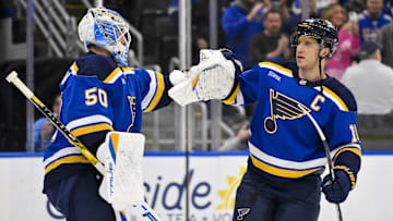 Nov 3, 2025; St. Louis, Missouri, USA; St. Louis Blues center Brayden Schenn (10) celebrates with goaltender Jordan Binnington (50) after the Blues defeated the Edmonton Oilers at Enterprise Center. Mandatory Credit: Jeff Curry-Imagn Images