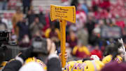 Nov 29, 2024; Madison, Wisconsin, USA;  The Minnesota Golden Gophers hold the Paul Bunyan Football Trophy following the game against the Wisconsin Badgers at Camp Randall Stadium. Mandatory Credit: Jeff Hanisch-Imagn Images