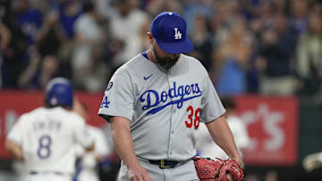 Apr 19, 2025; Arlington, Texas, USA; Los Angeles Dodgers relief pitcher Kirby Yates (38) walks to the dugout after giving up the game winning home run to Texas Rangers right fielder Ardolis Garcia (not shown) during the ninth inning at Globe Life Field. Mandatory Credit: Jim Cowsert-Imagn Images