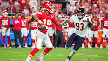 Aug 22, 2025; Kansas City, Missouri, USA; Kansas City Chiefs quarterback Chris Oladokun (19) throws a pass as Chicago Bears defensive end Xavier Carlton (93) defends during the second half of the game at GEHA Field at Arrowhead Stadium. Mandatory Credit: Denny Medley-Imagn Images
