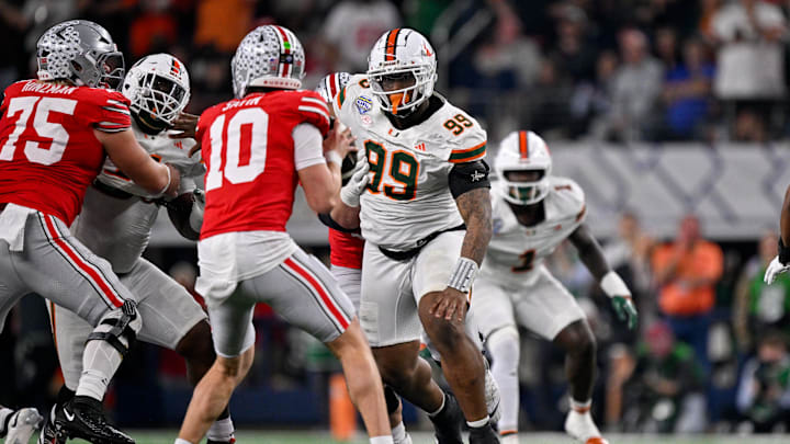 Dec 31, 2025; Arlington, TX, USA; Miami Hurricanes defensive lineman Ahmad Moten Sr. (99) rushes Ohio State Buckeyes quarterback Julian Sayin (10) during the 2025 Cotton Bowl and quarterfinal game of the College Football Playoff at AT&T Stadium. Mandatory Credit: Jerome Miron-Imagn Images