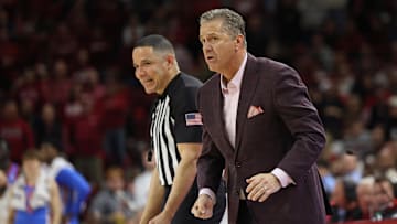 Jan 8, 2025; Fayetteville, Arkansas, USA; Arkansas Razorbacks head coach John Calipari discusses a call with an official during the second half against the Ole Miss Rebels at Bud Walton Arena. Ole Miss won 73-66. Mandatory Credit: Nelson Chenault-Imagn Images