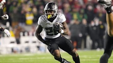 Nov 16, 2024; Madison, Wisconsin, USA;  Oregon Ducks running back Jordan James (20) during the game against the Wisconsin Badgers at Camp Randall Stadium. Mandatory Credit: Jeff Hanisch-Imagn Images