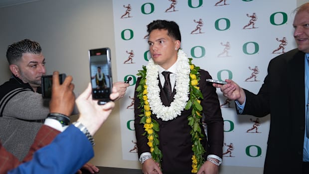 Oregon Ducks quarterback Dillon Gabriel answers questions during media interviews before the 2024 Heisman Trophy Presentation