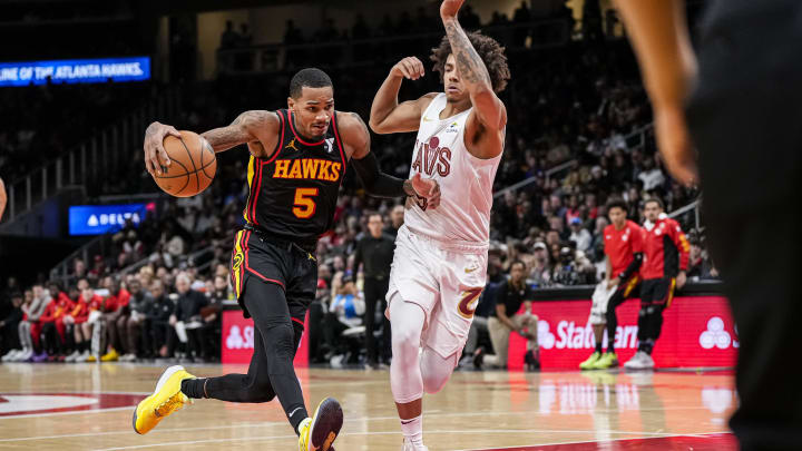 Jan 20, 2024; Atlanta, Georgia, USA; Atlanta Hawks guard Dejounte Murray (5) dribbles defended by Cleveland Cavaliers guard Craig Porter (9) during the second half at State Farm Arena. Mandatory Credit: Dale Zanine-USA TODAY Sports
