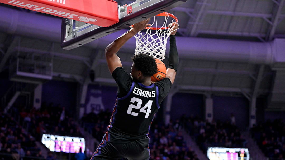 Jan 28, 2026; Fort Worth, Texas, USA; TCU Horned Frogs forward Xavier Edmonds (24) dunks the ball against the Houston Cougars during the first half at Ed and Rae Schollmaier Arena. Mandatory Credit: Jerome Miron-Imagn Images