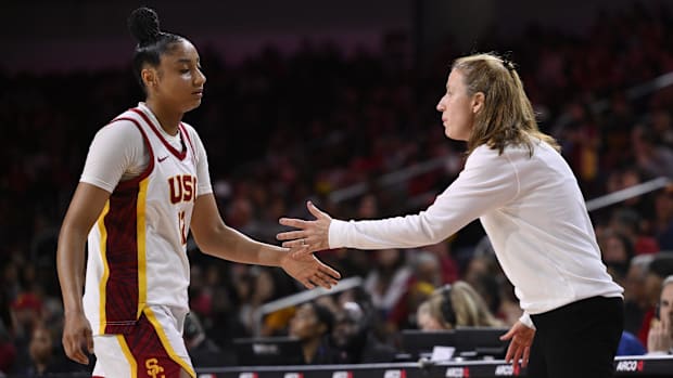  USC Trojans guard JuJu Watkins (12) celebrates with head coach Lindsay Gottlieb in the fourth quarter against Ohio State
