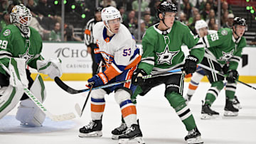 Oct 12, 2024; Dallas, Texas, USA; New York Islanders center Casey Cizikas (53) and Dallas Stars defenseman Nils Lundkvist (5) in action during the game between the Dallas Stars and the New York Islanders at the American Airlines Center. Mandatory Credit: Jerome Miron-Imagn Images