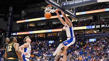 Mar 14, 2025; Nashville, TN, USA;  Florida Gators guard Walter Clayton Jr. (1) dunks the ball against the Missouri Tigers during the first half at Bridgestone Arena. Mandatory Credit: Steve Roberts-Imagn Images